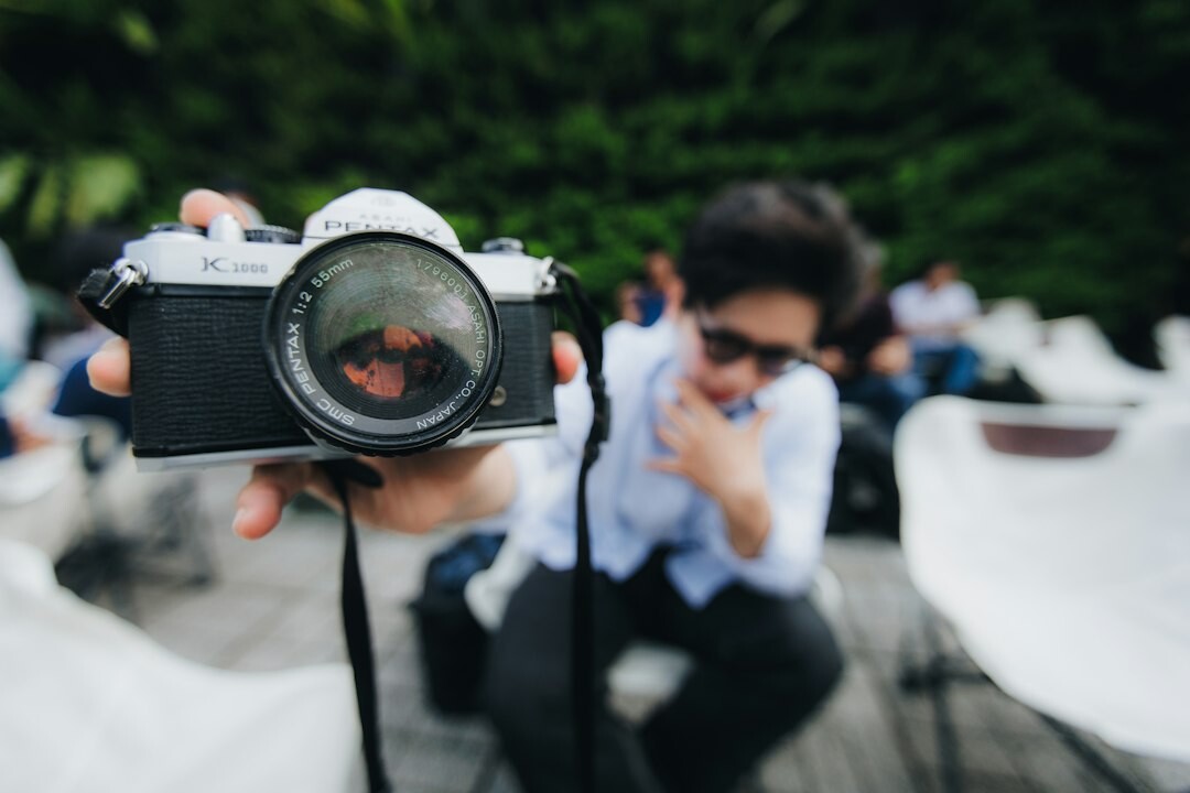 Professional photographer taking pictures with a camera at an event