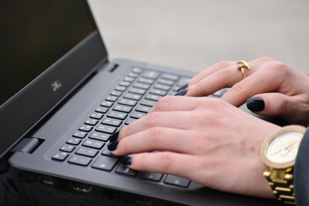 blogger writing on laptop